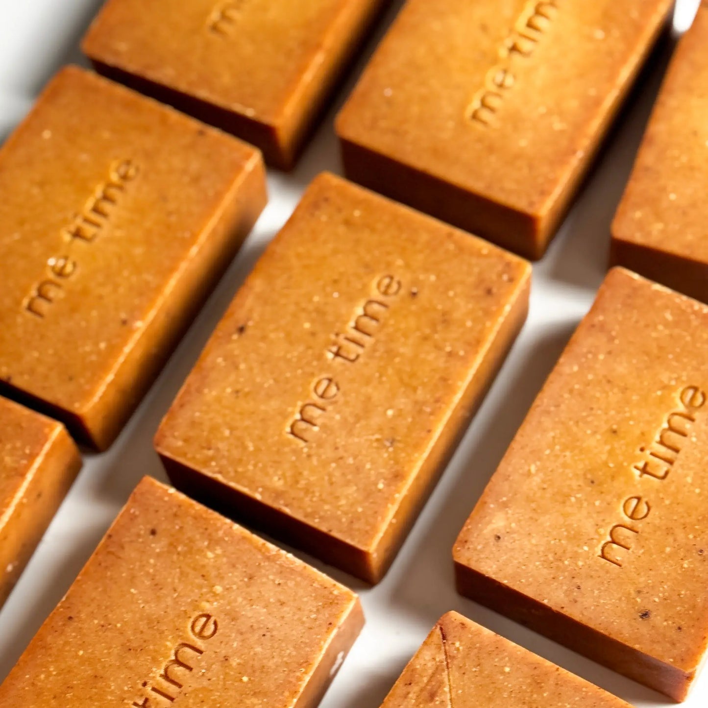 Handcrafted Radiance Turmeric Soap bar made with natural turmeric powder, olive oil, coconut oil, and citrus essential oils. Designed to brighten and nourish skin for a radiant glow.