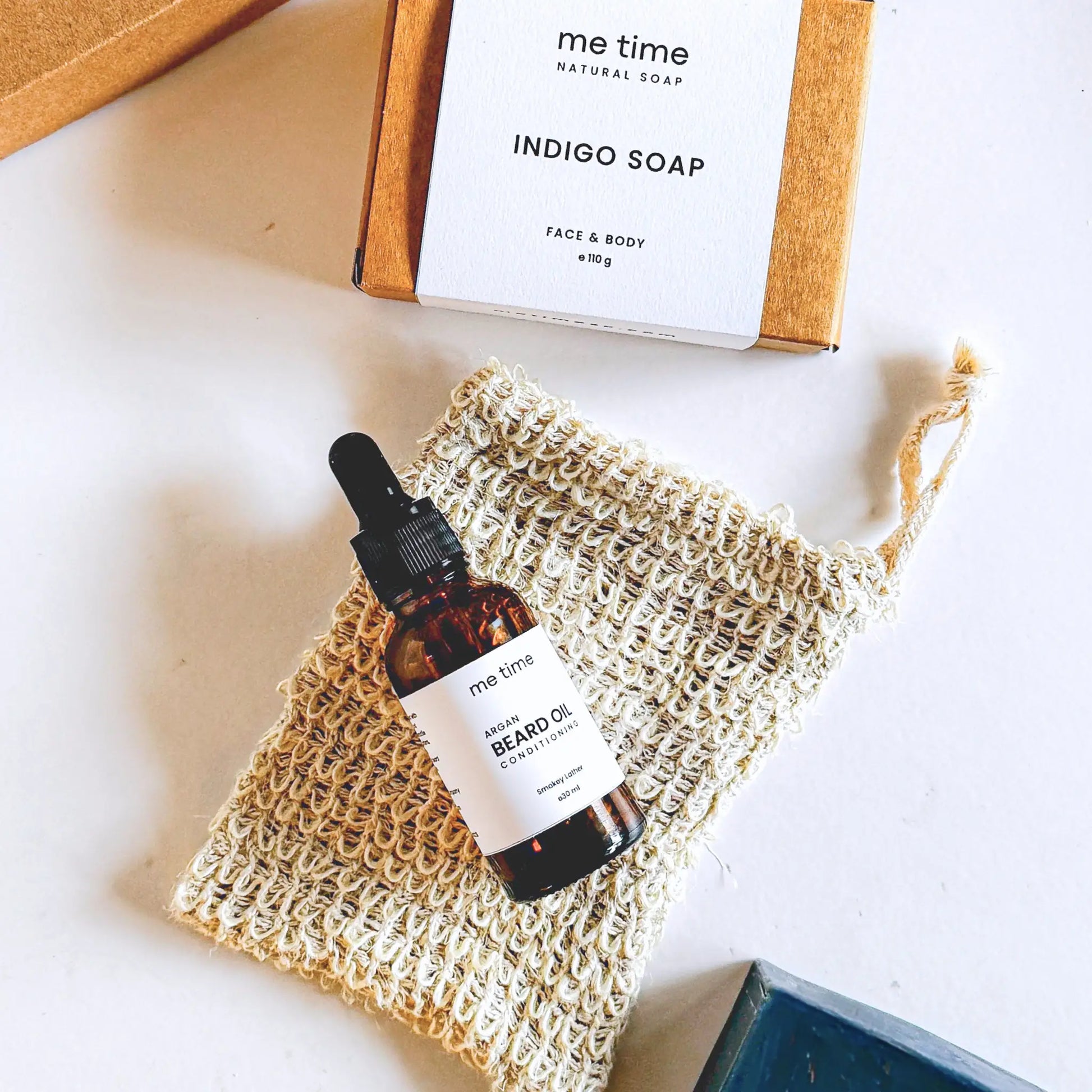 The Ultimate Self-Care Kit for Him – A luxurious men's grooming gift set featuring handcrafted Indigo Artisan Soap, Argan Conditioning Beard Oil, and an Exfoliating Soap Pouch. 100% natural, eco-friendly, and designed for deep hydration, nourishment, and relaxation