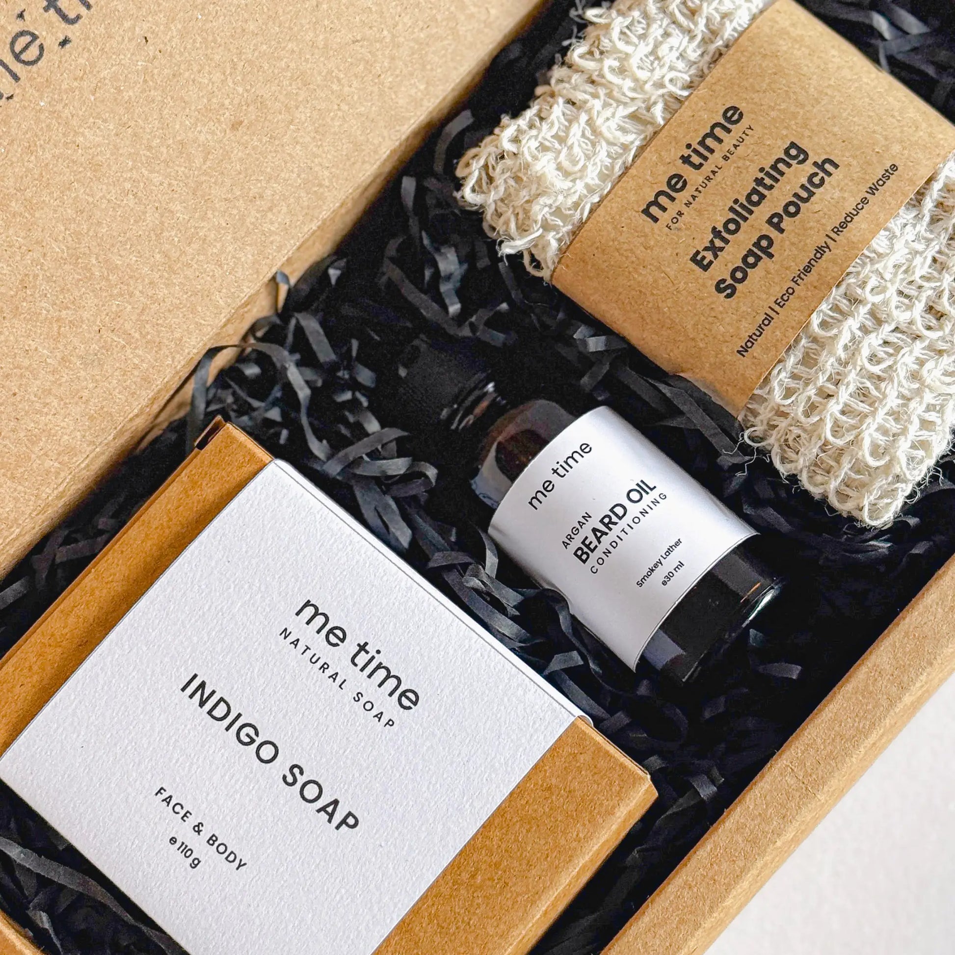 The Ultimate Self-Care Kit for Him – A luxurious men's grooming gift set featuring handcrafted Indigo Artisan Soap, Argan Conditioning Beard Oil, and an Exfoliating Soap Pouch. 100% natural, eco-friendly, and designed for deep hydration, nourishment, and relaxation