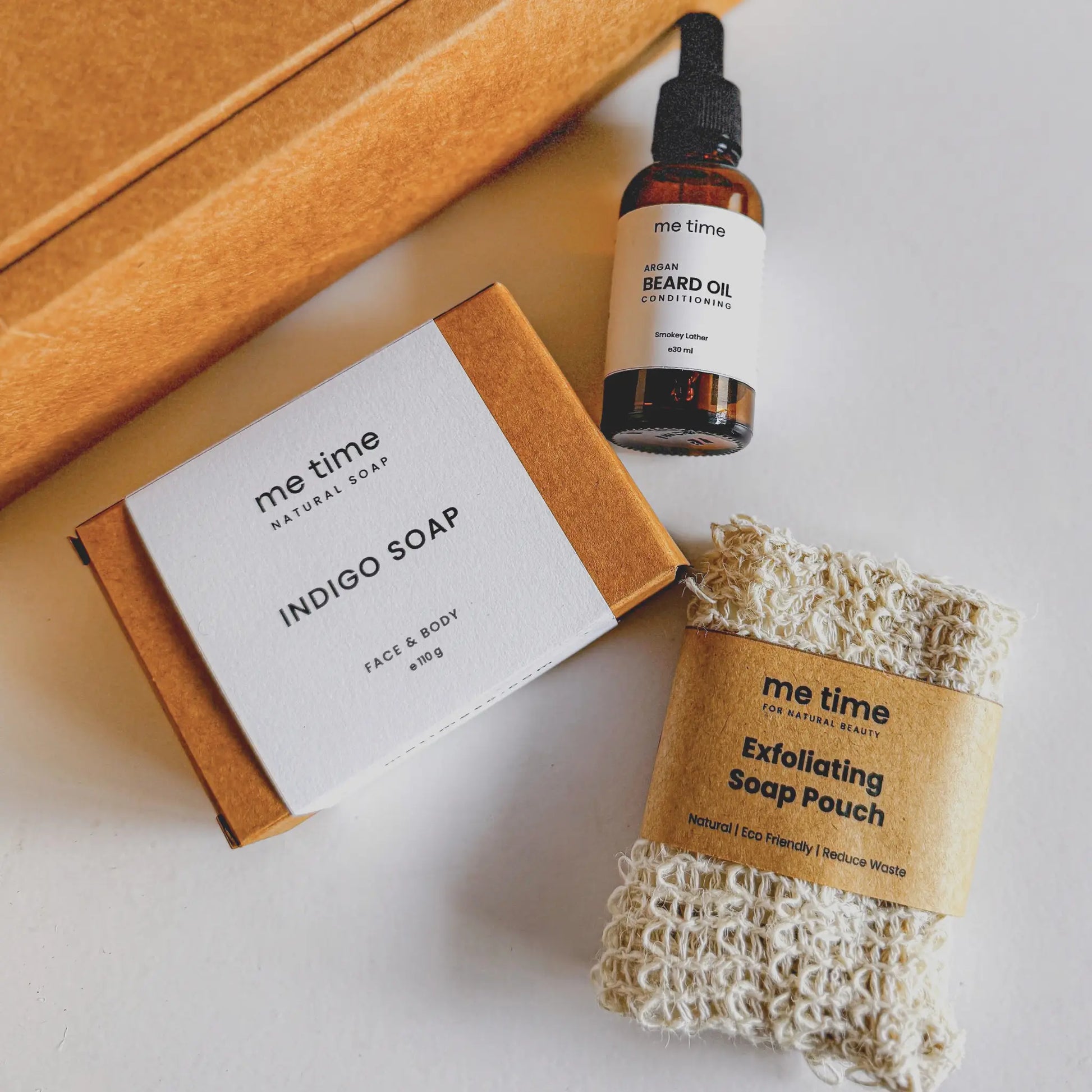 The Ultimate Self-Care Kit for Him – A luxurious men's grooming gift set featuring handcrafted Indigo Artisan Soap, Argan Conditioning Beard Oil, and an Exfoliating Soap Pouch. 100% natural, eco-friendly, and designed for deep hydration, nourishment, and relaxation