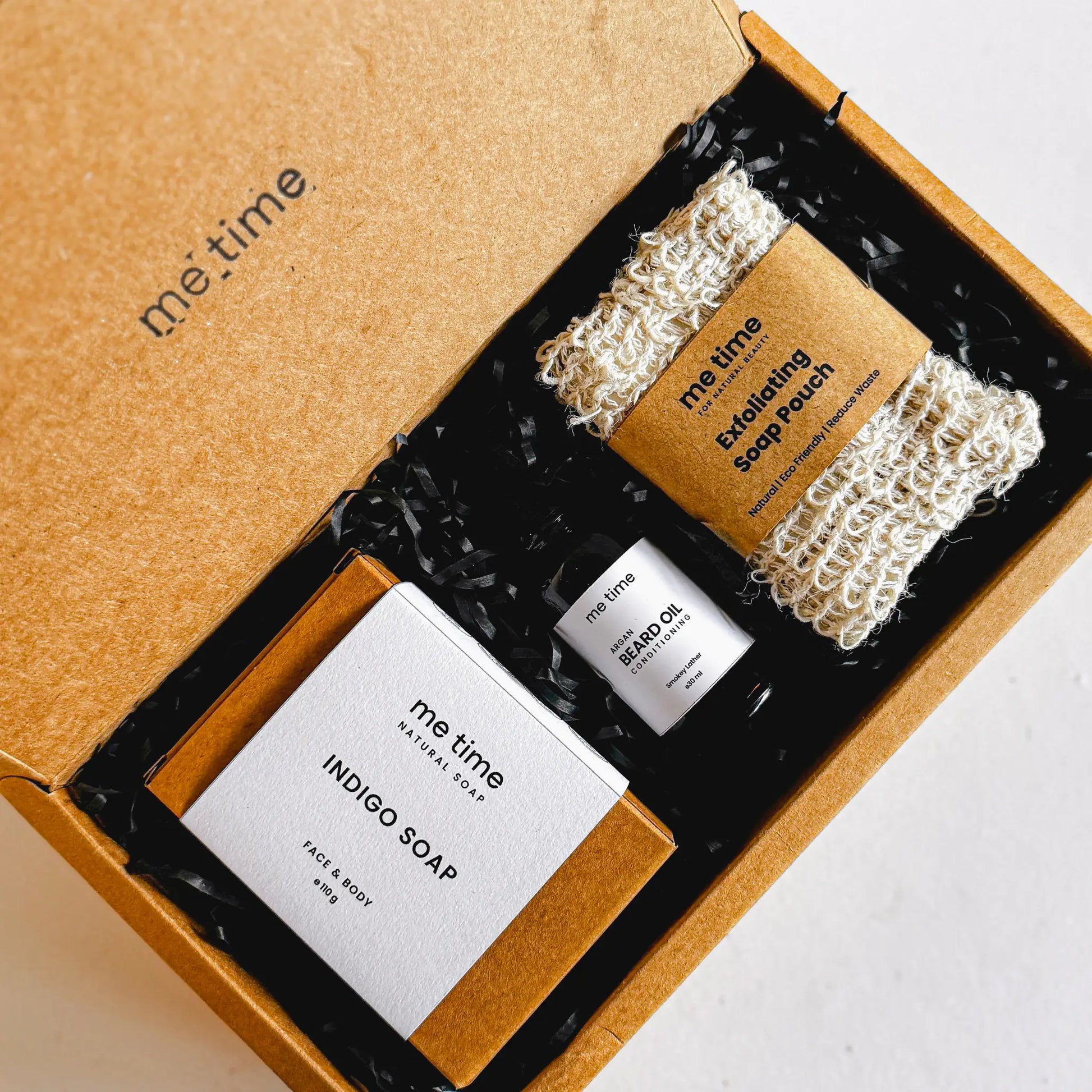 The Ultimate Self-Care Kit for Him – A luxurious men's grooming gift set featuring handcrafted Indigo Artisan Soap, Argan Conditioning Beard Oil, and an Exfoliating Soap Pouch. 100% natural, eco-friendly, and designed for deep hydration, nourishment, and relaxation