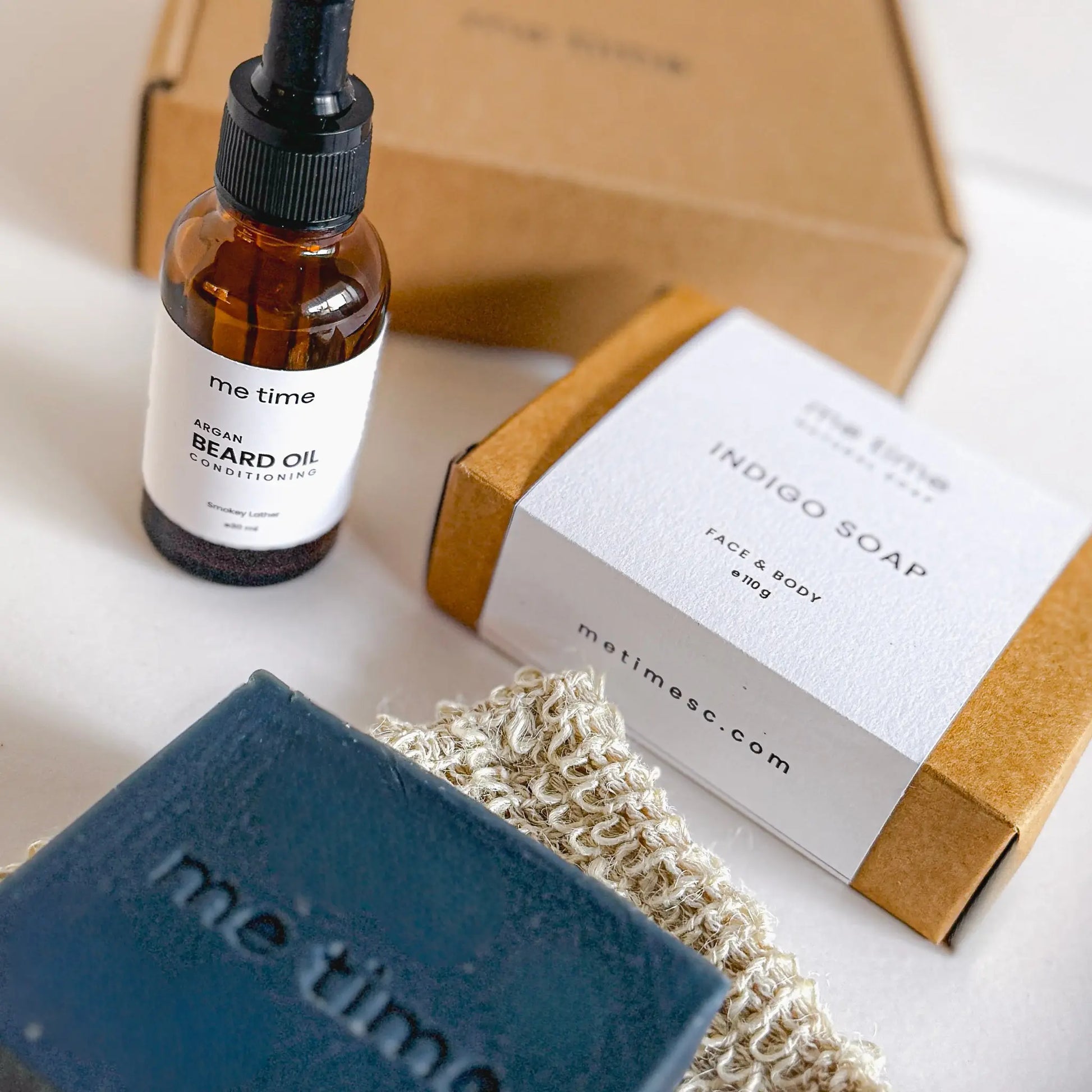 The Ultimate Self-Care Kit for Him – A luxurious men's grooming gift set featuring handcrafted Indigo Artisan Soap, Argan Conditioning Beard Oil, and an Exfoliating Soap Pouch. 100% natural, eco-friendly, and designed for deep hydration, nourishment, and relaxation