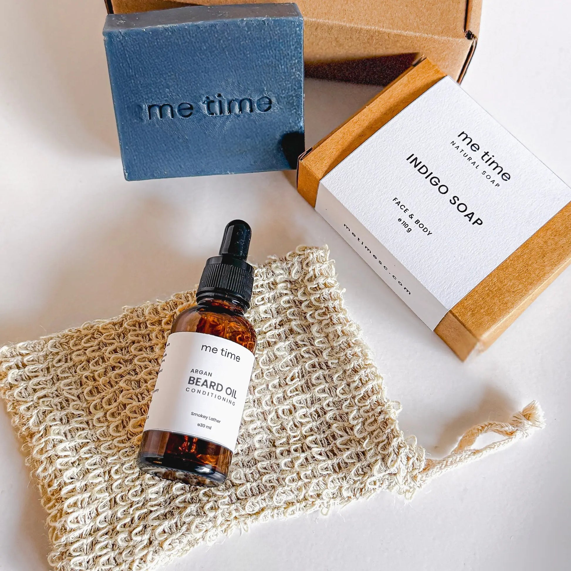 The Ultimate Self-Care Kit for Him – A luxurious men's grooming gift set featuring handcrafted Indigo Artisan Soap, Argan Conditioning Beard Oil, and an Exfoliating Soap Pouch. 100% natural, eco-friendly, and designed for deep hydration, nourishment, and relaxation