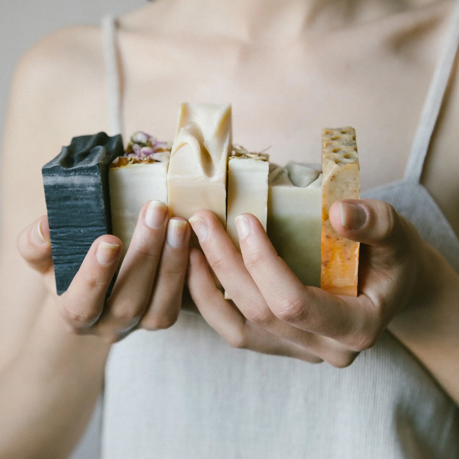 a lady holding me time natural handmade soap bars
