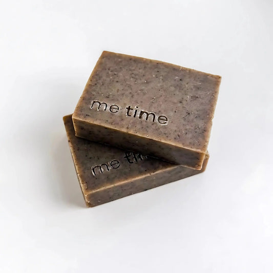 Minimal product photo of two Black Seed Soap bars with white background  