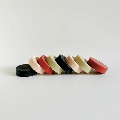 Whispers of the Earth luxury natural soap collection – four round clay and charcoal bars handcrafted by Me Time Soaps for women in the UAE.