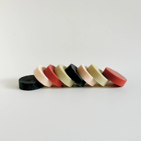 Whispers of the Earth luxury natural soap collection – four round clay and charcoal bars handcrafted by Me Time Soaps for women in the UAE.