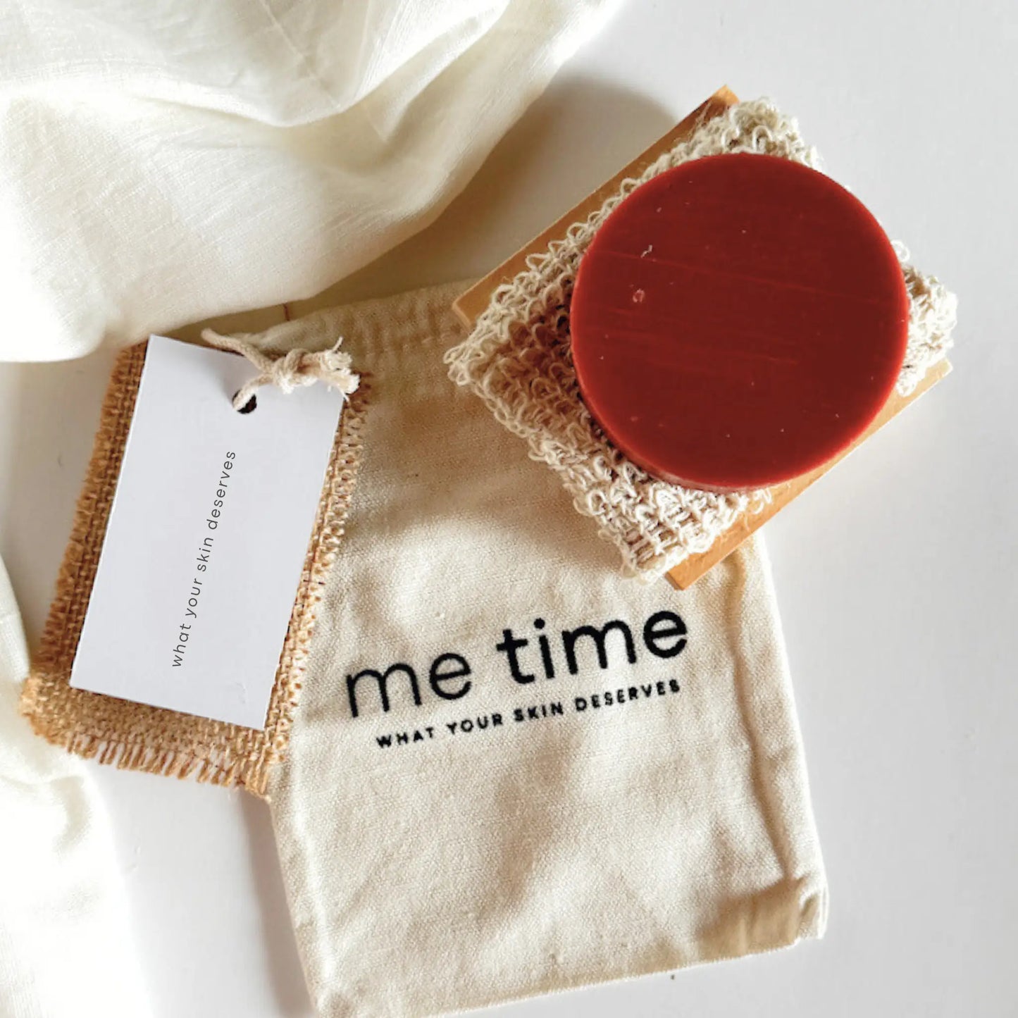 Reusable cotton gift bag holding Daily Care Set  items