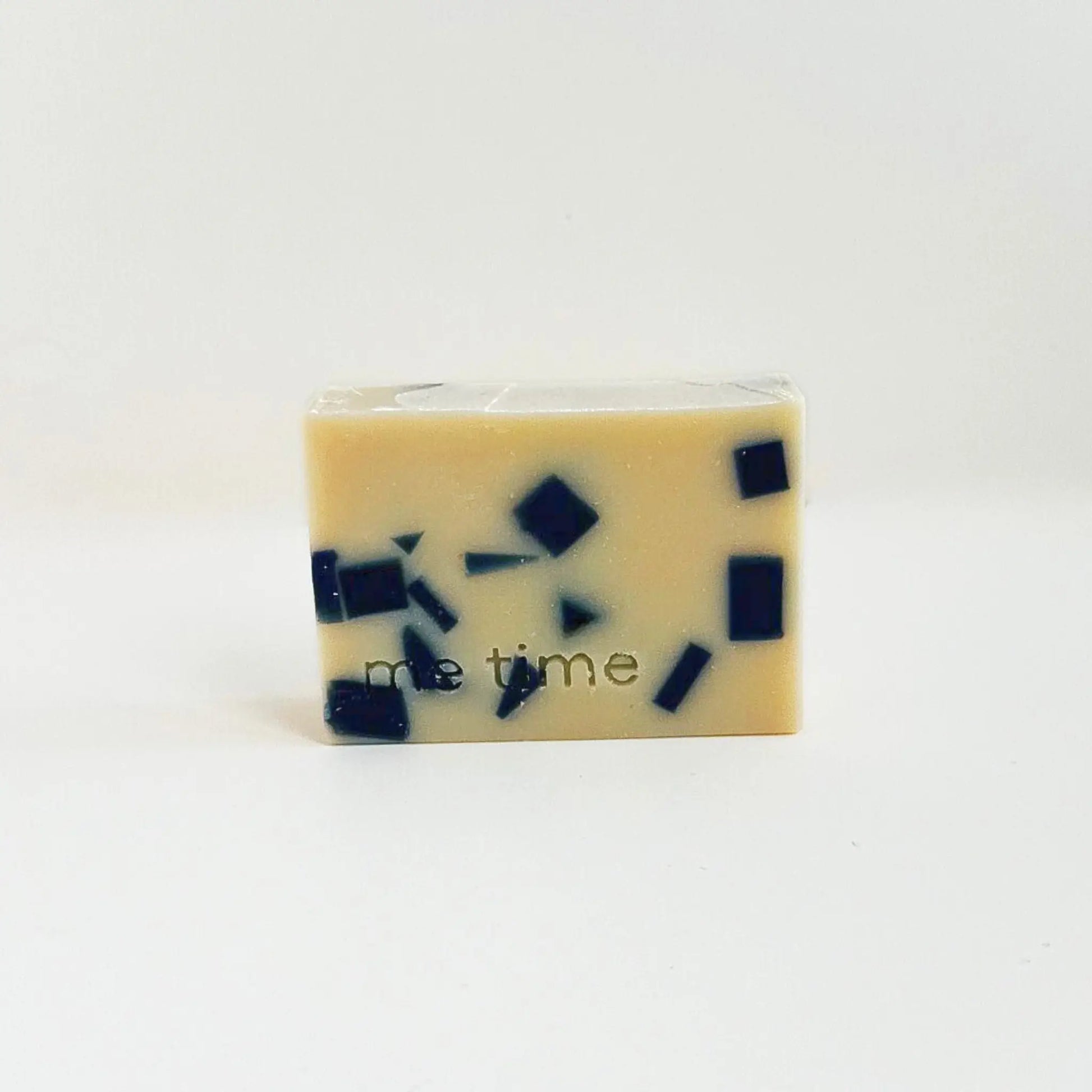 Artisan mosaic soap in off-white and deep navy tones, handcrafted in UAE with essential oils.